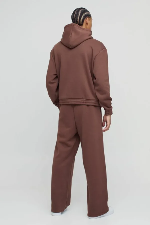 boohooMAN Oversized Boxy Wide Leg Hooded Tracksuit With Rubber Badge | Tracksuits