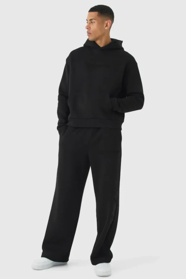 boohooMAN Oversized Boxy Worldwide Emboss Wide Leg Tracksuit | Tracksuits