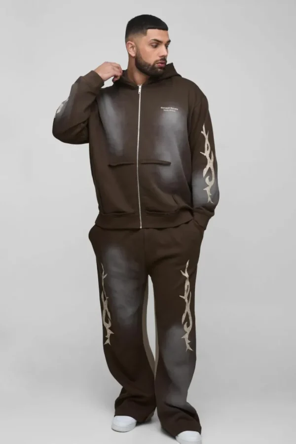 boohooMAN Plus Oversized Zip Thru Graphic Spray Wash Hooded Relaxed Flare Tracksuit | Tracksuits