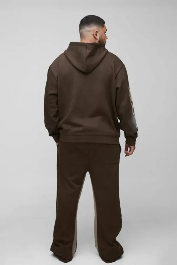 boohooMAN Plus Oversized Zip Thru Graphic Spray Wash Hooded Relaxed Flare Tracksuit | Tracksuits