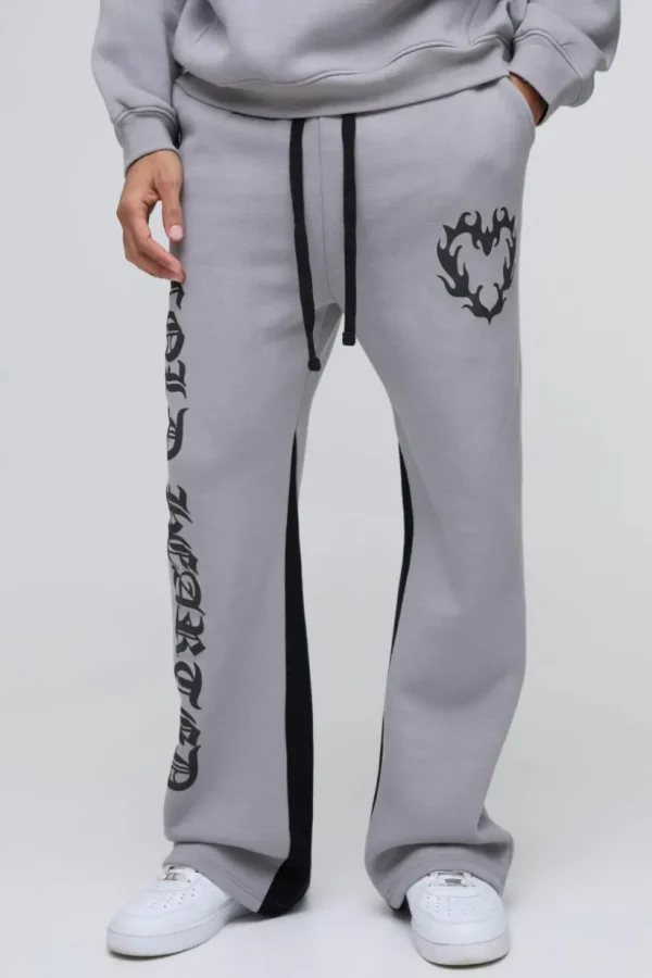 boohooMAN Relaxed Flare Cold Hearted Puff Print Gusset Jogger | Trousers | Joggers