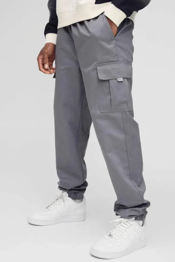 boohooMAN Slim Fit Elasticated Waist Woven Tab Cuffed Cargo Trousers | Trousers | Cargo Trousers