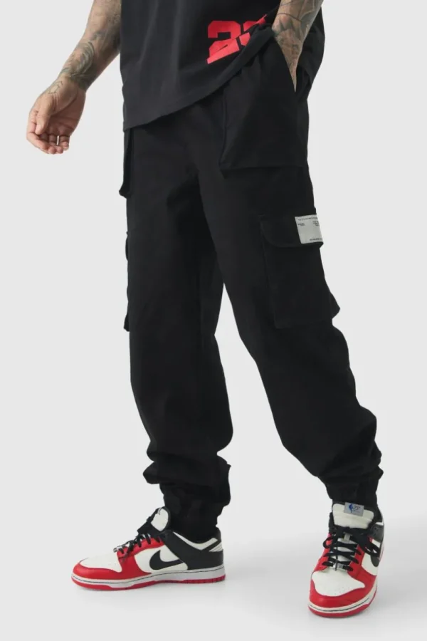 boohooMAN Tall Cuffed Hem Woven Tab Cargo Trousers In | Trousers