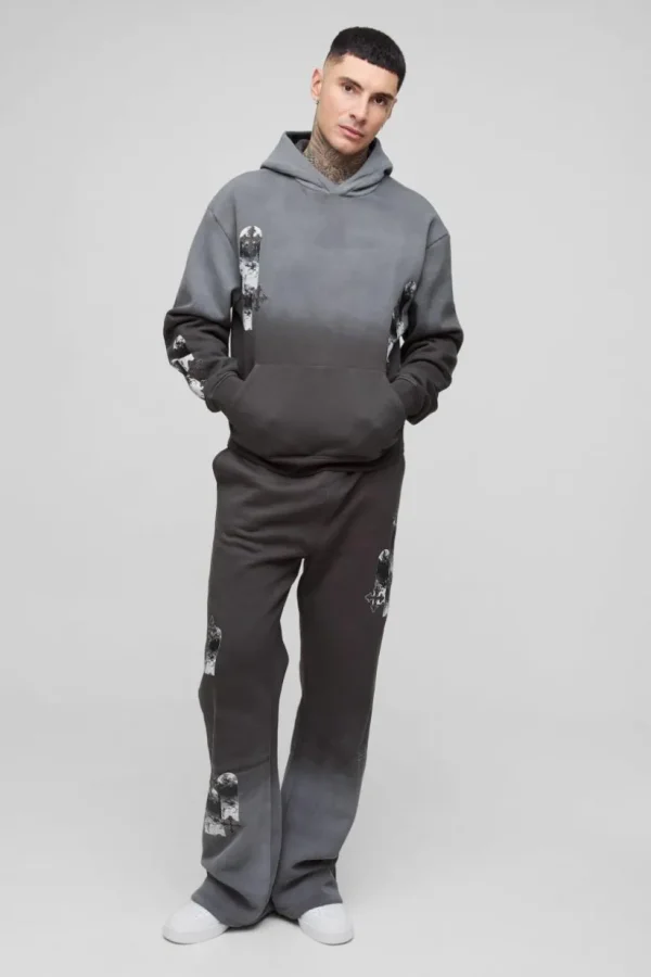 boohooMAN Tall Oversized Boxy Applique Cross Spray Wash Hooded Relaxed Flare Tracksuit | Tracksuits