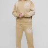 boohooMAN Tall Oversized Boxy Distressed Official Applique Spray Wash Hooded Tracksuit | Tracksuits