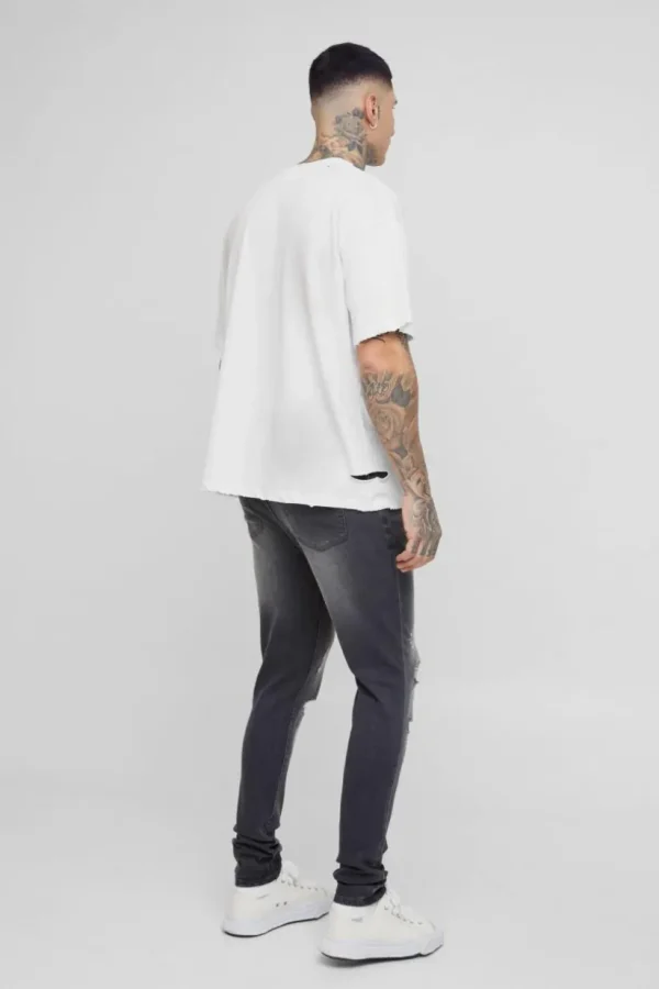 boohooMAN Tall Skinny All Over Ripped Bleached Paint Splatter Jeans | Denim | Going Out Denim